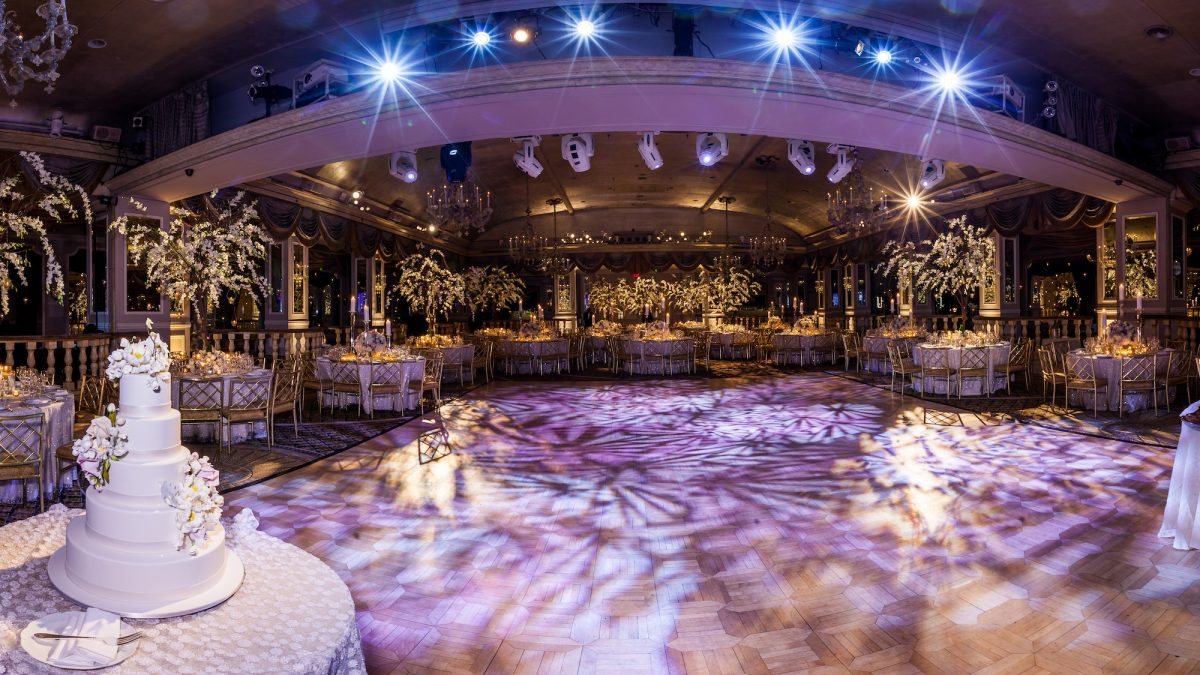 An illuminated event ballroom ready to welcome guests