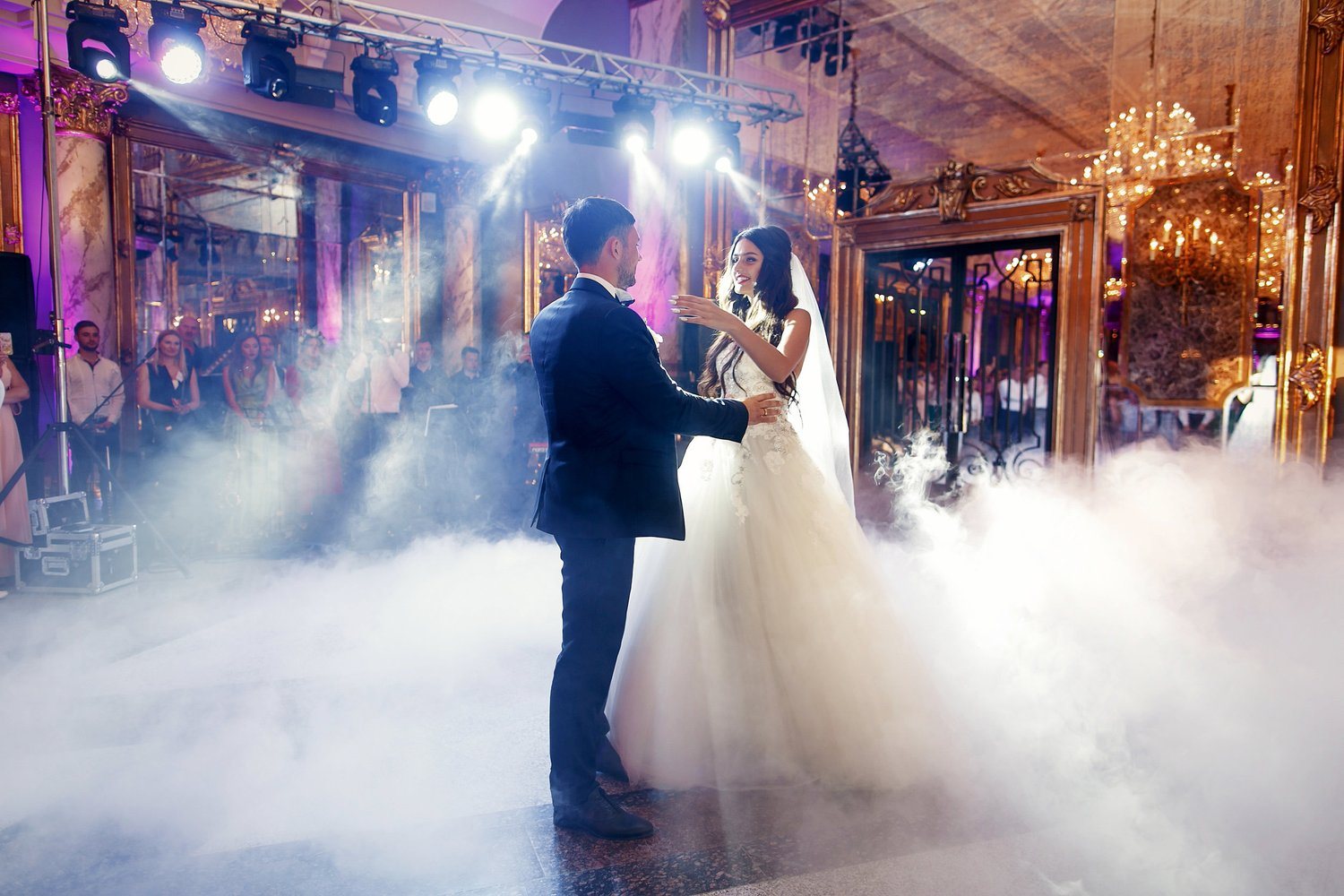 A couple sharing their first dance at a wedding reception